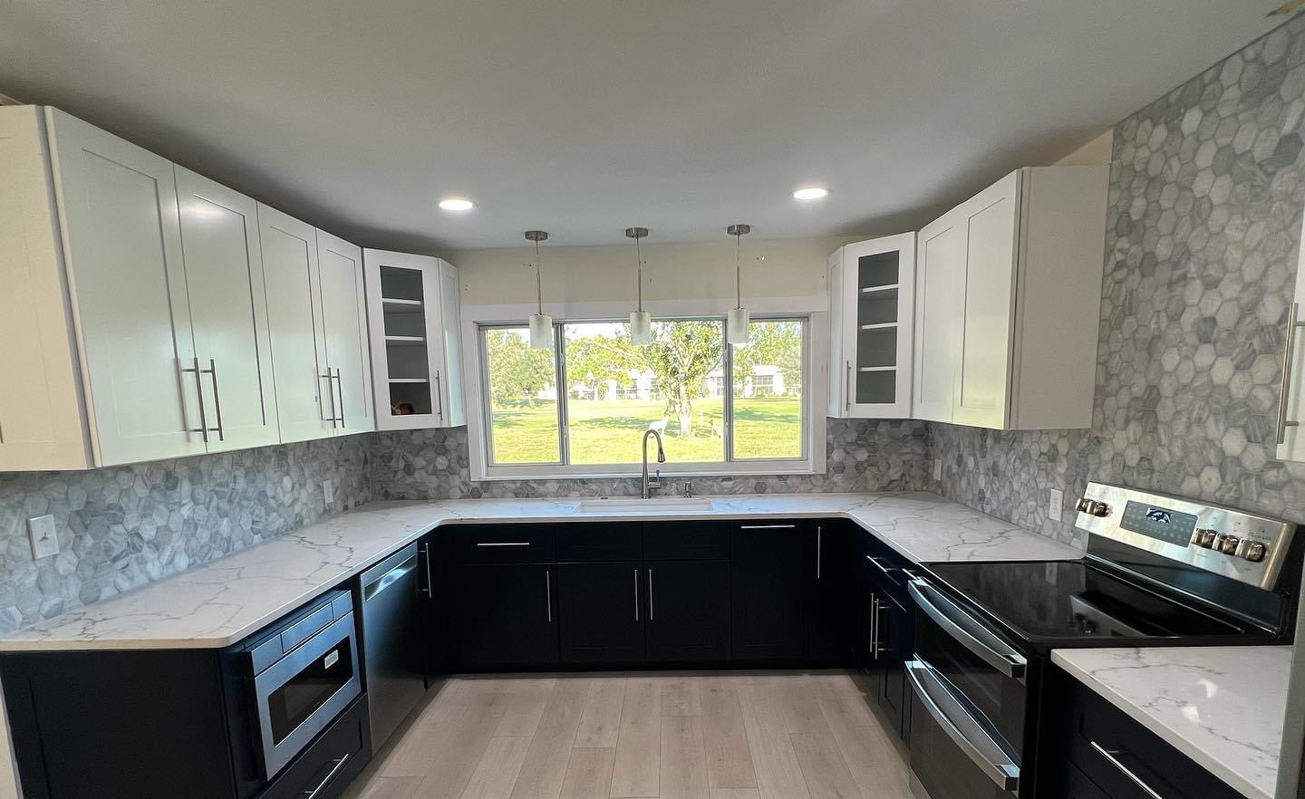 Two-tone black and white kitchen cabinet installation