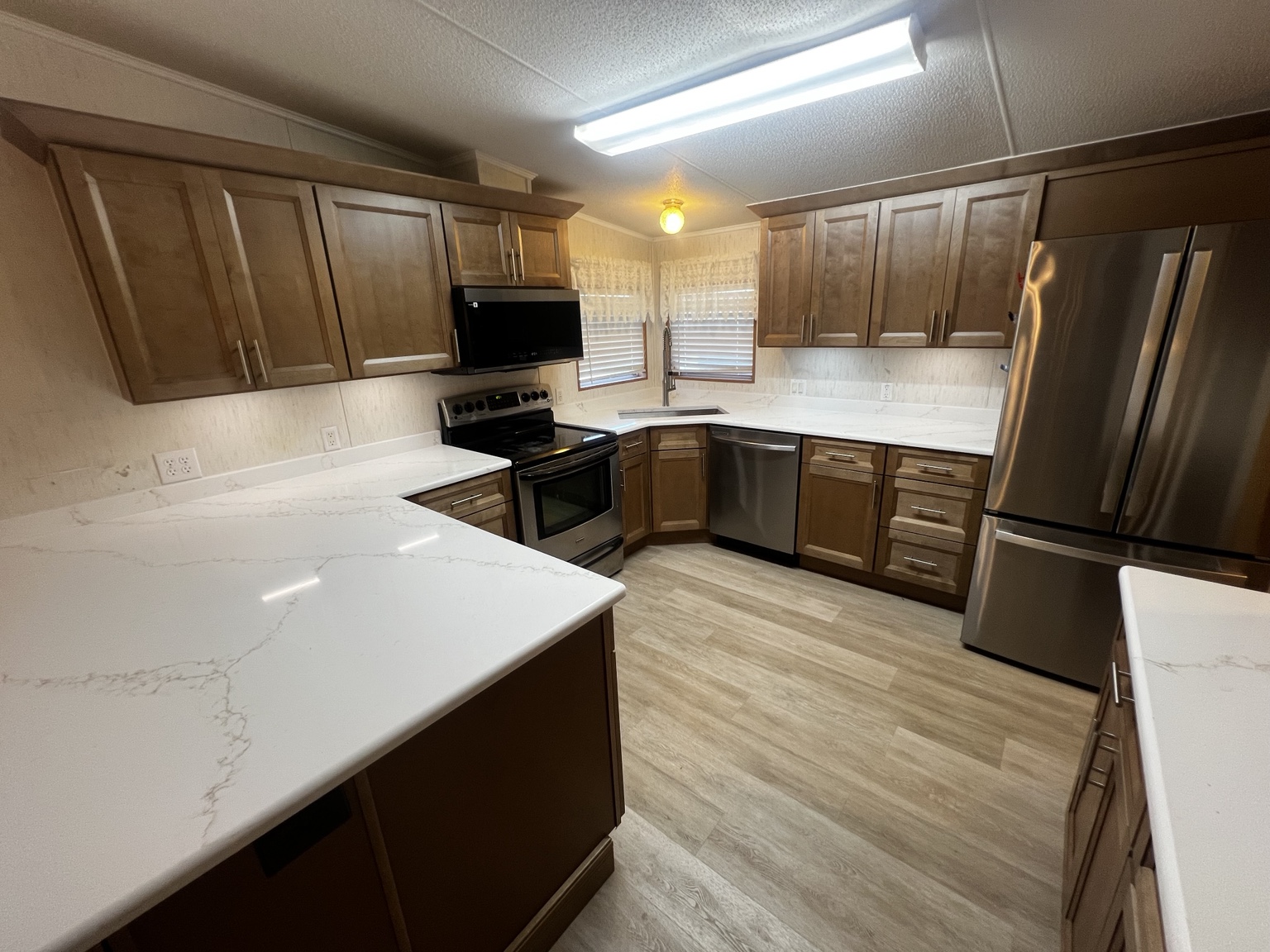 Completed Florida job with new cabinets, countertops, and full-height backsplash