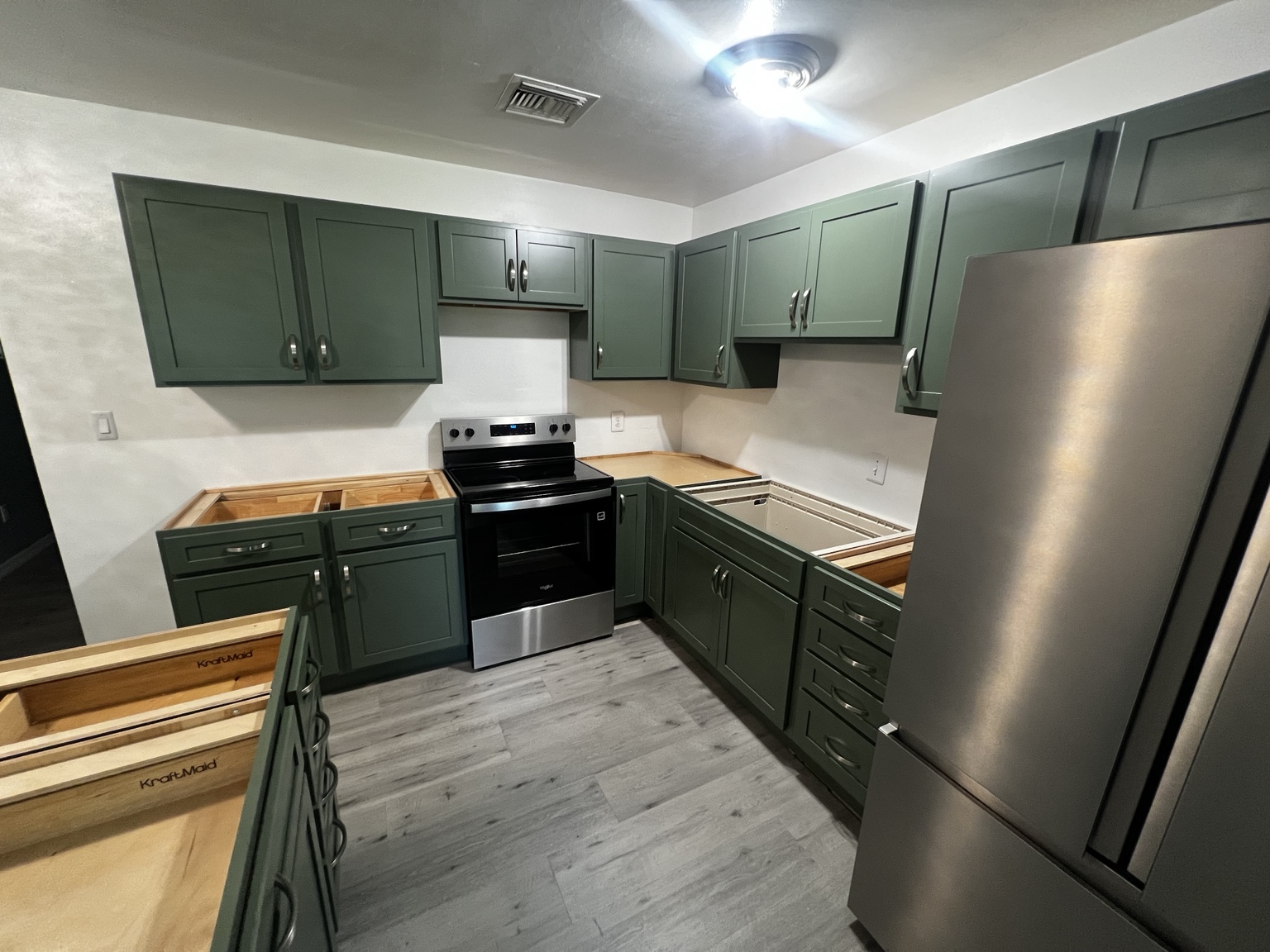 Green Shaker cabinet installation detail